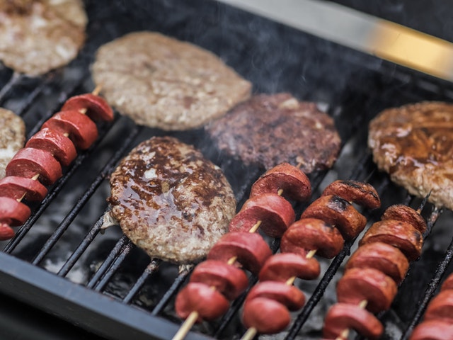 Hot dogs & burger patties on grill